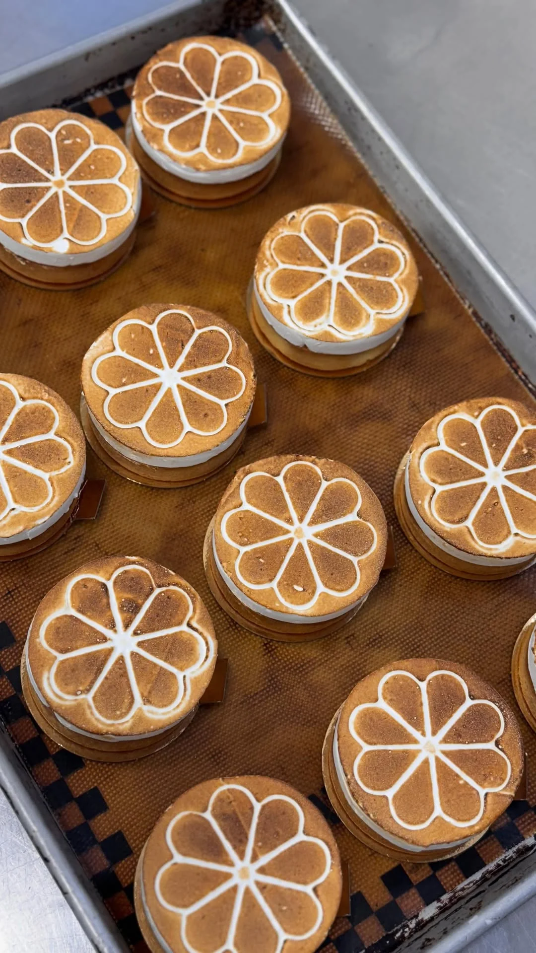 Sun — torched Italian meringue over lemon curd on a sablé Breton base